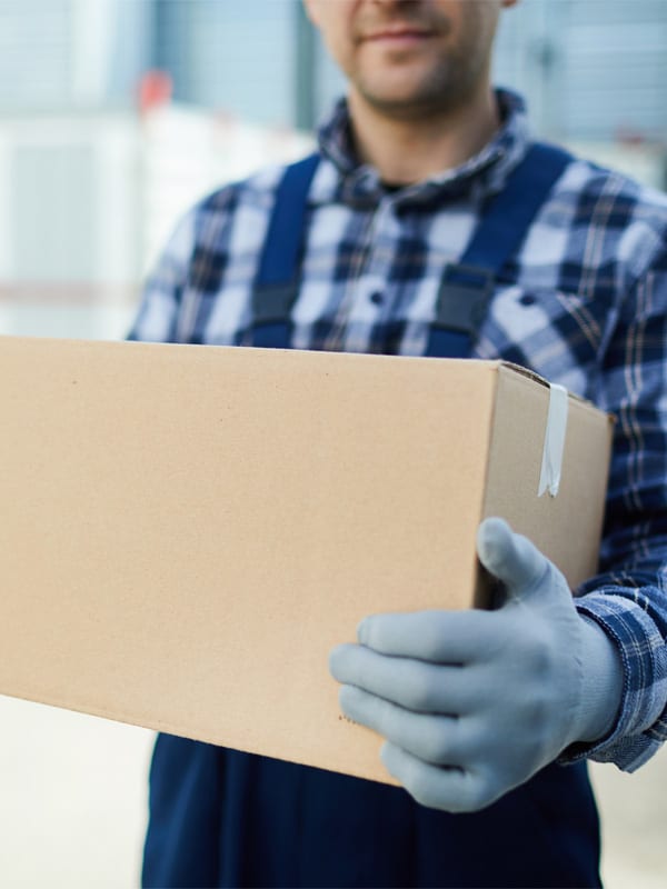 Professional mover handling a box and moving it.