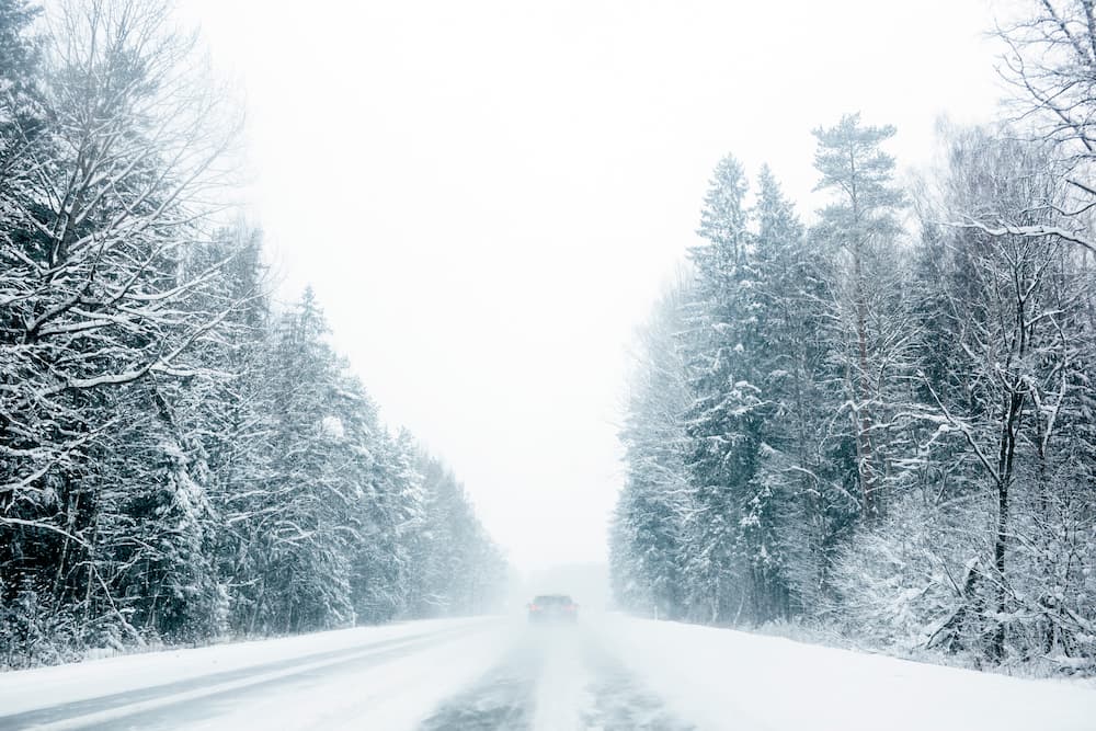 MN Winter moving and how to survive it going down a snowy road
