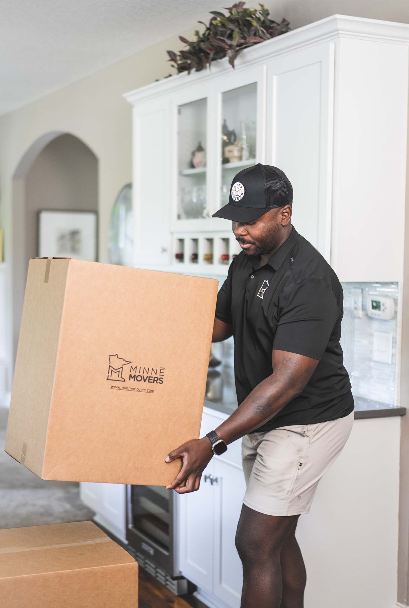 Minnē Movers team packing boxes for a move